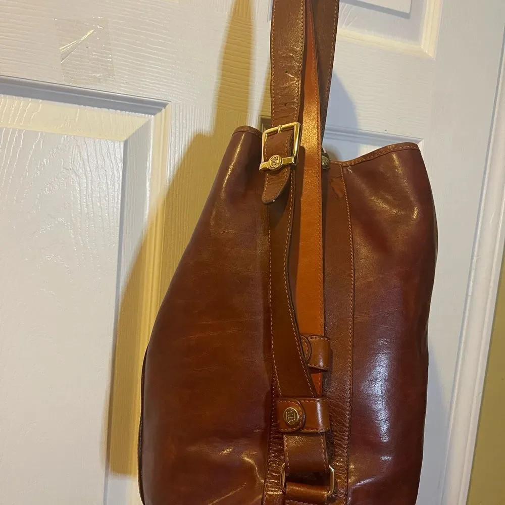 Fortune Duck vintage leather Brown sling back bucket style bag.